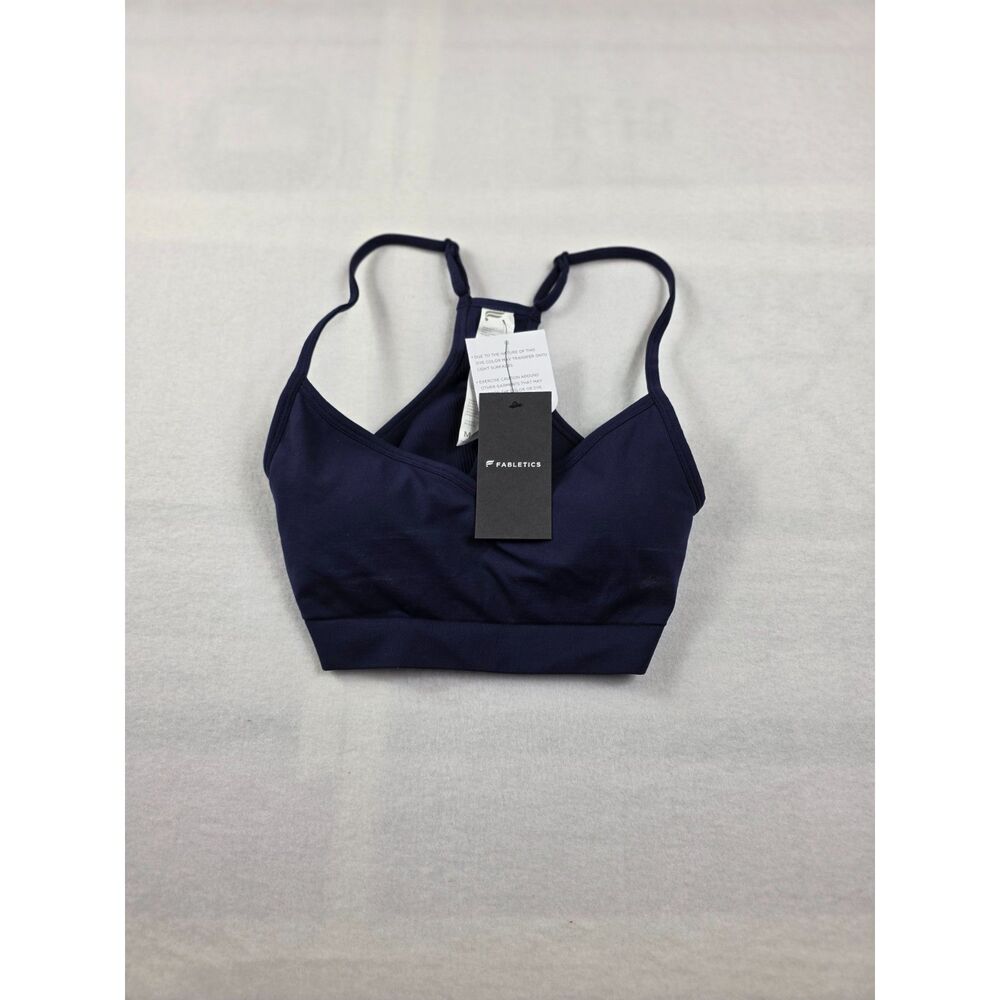 NWT Blue Fabletics sports bra features a V-neckline and adjustable strappy back